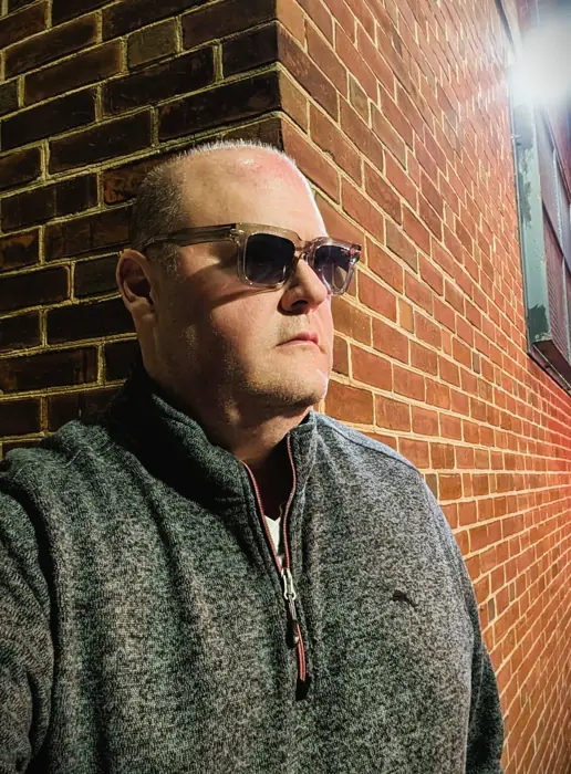 WitheringWithout: brick corner, shades on